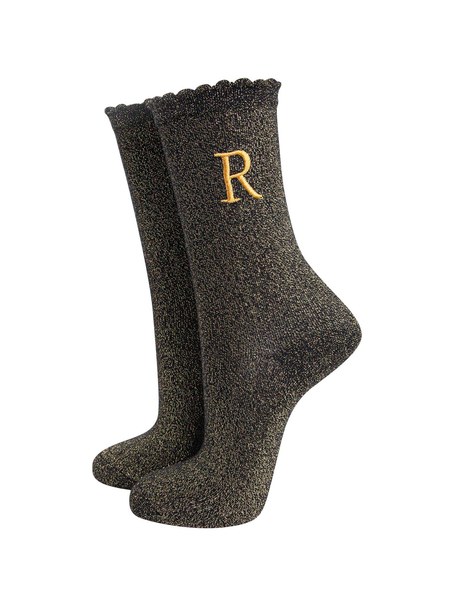 black ankle socks with a scalloped cuff, with an all over gold glitter sparkle and an embroidered gold letter on the ankle
