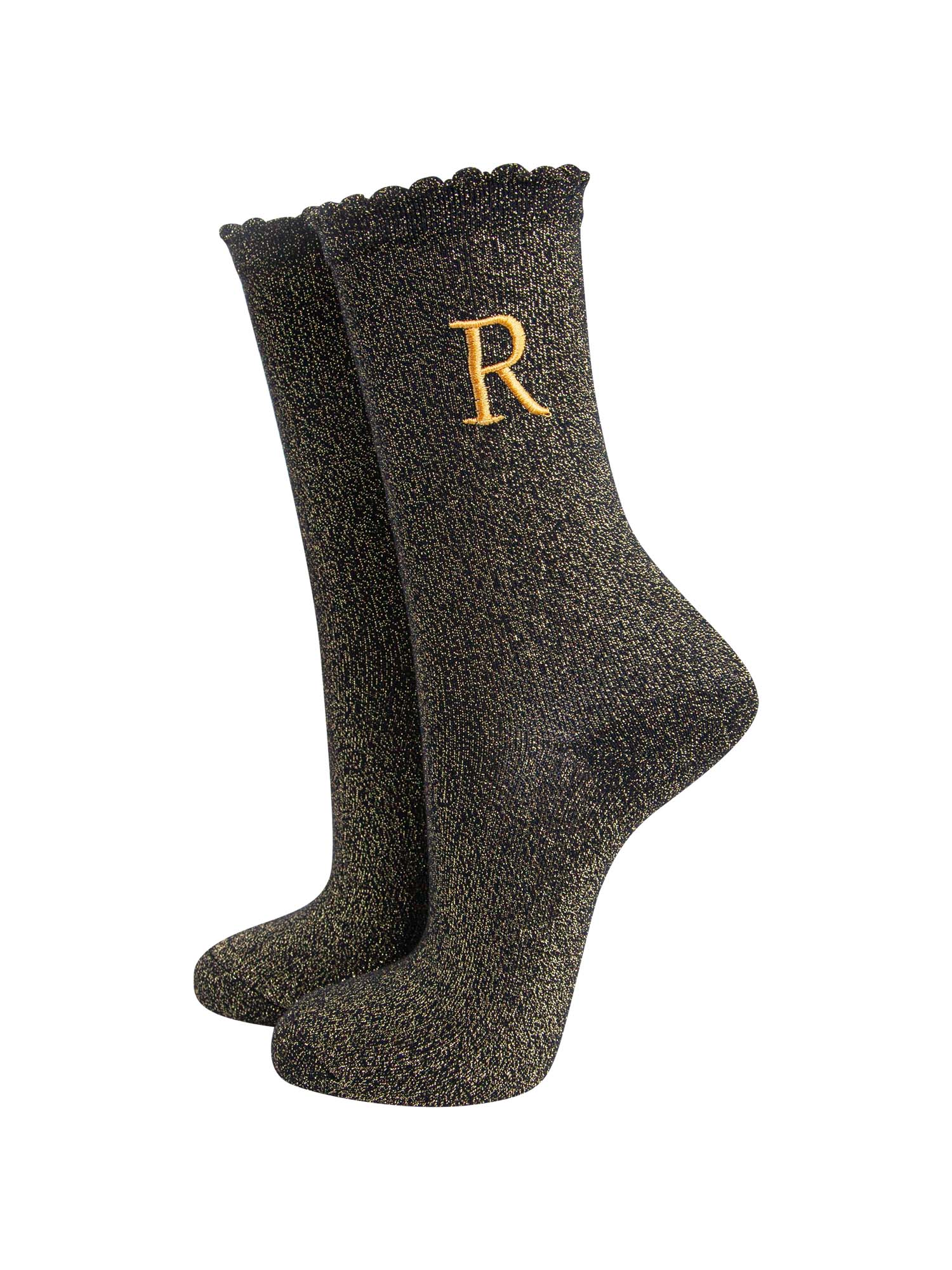 black ankle socks with a scalloped cuff, with an all over gold glitter sparkle and an embroidered gold letter on the ankle