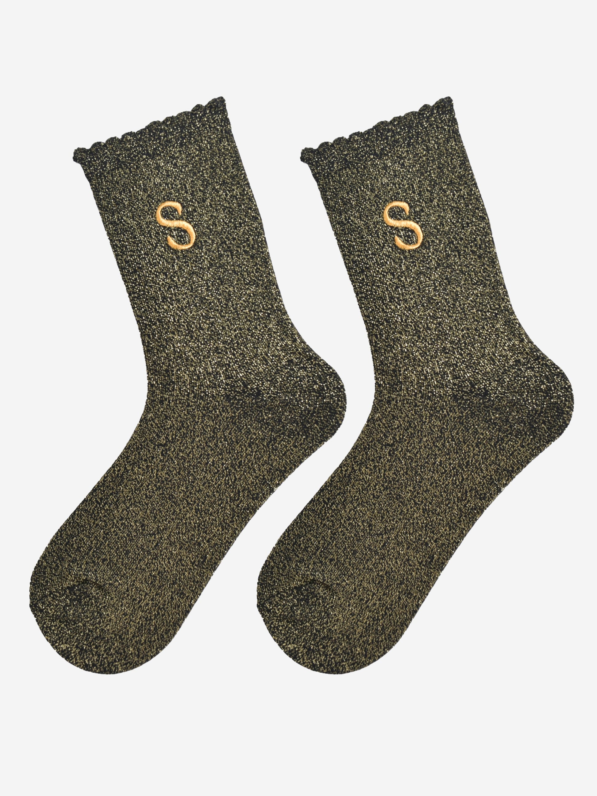 showing the glitter socks laying flat, they have a scalloped cuff and an all over gold sparkle