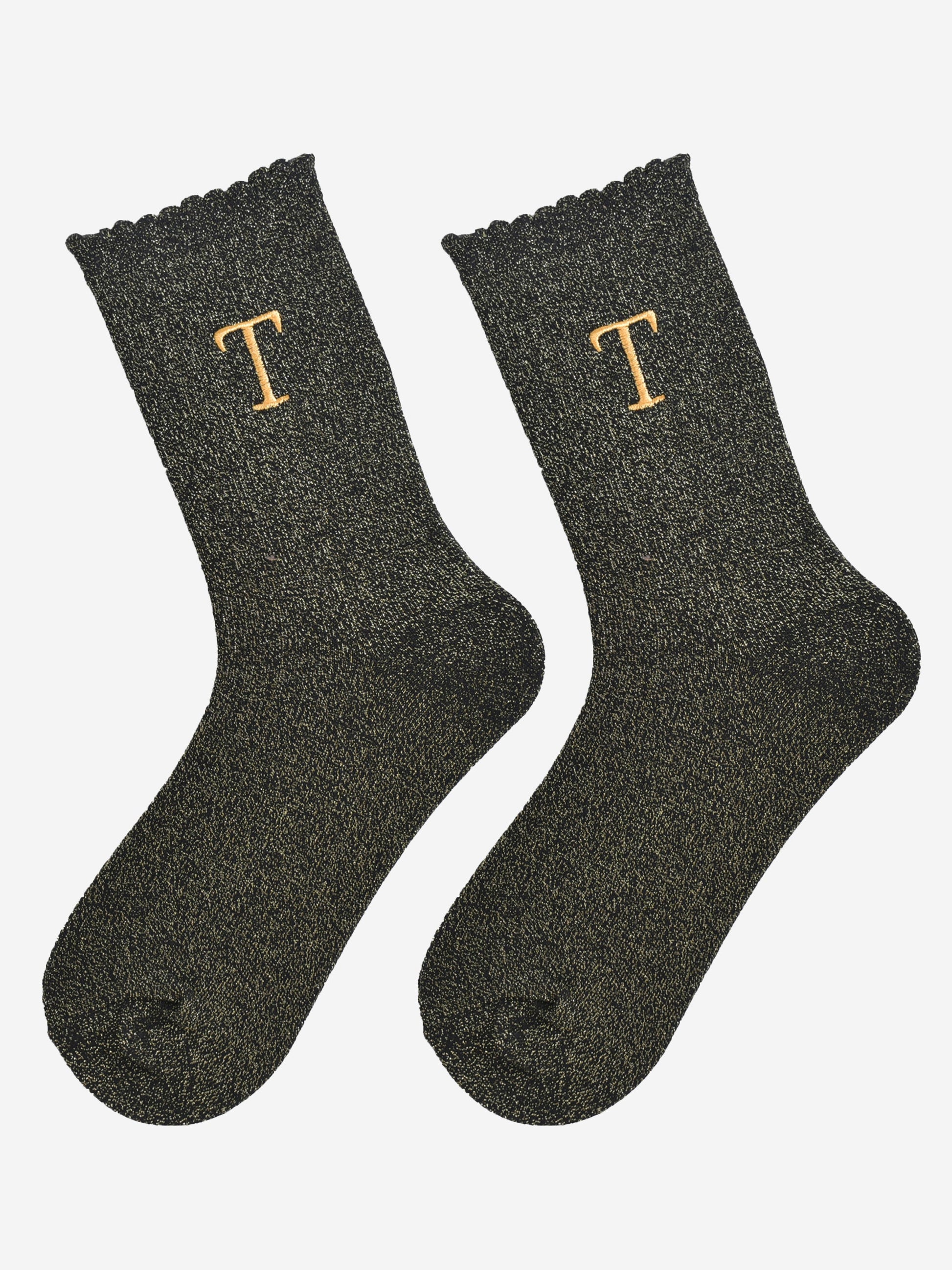 showing the glitter socks laying flat, they have a scalloped cuff and an all over gold sparkle