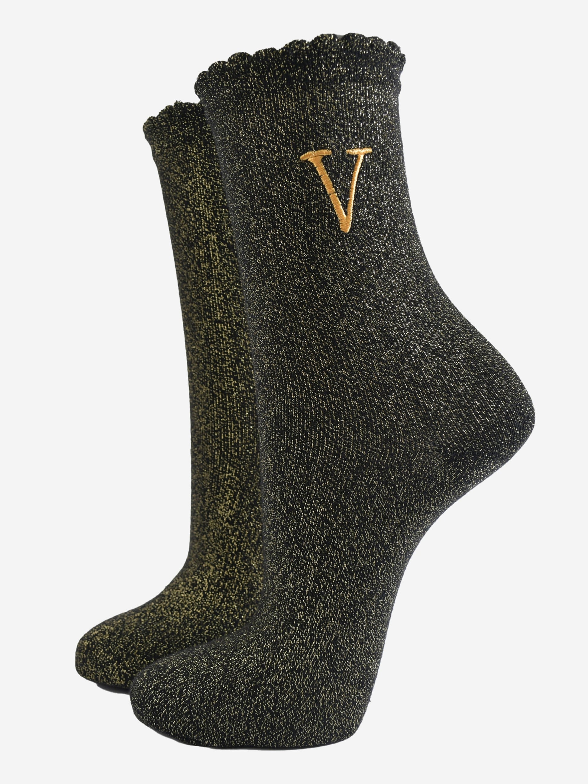 black ankle socks with a scalloped cuff, with an all over gold glitter sparkle and an embroidered gold letter v on the ankle