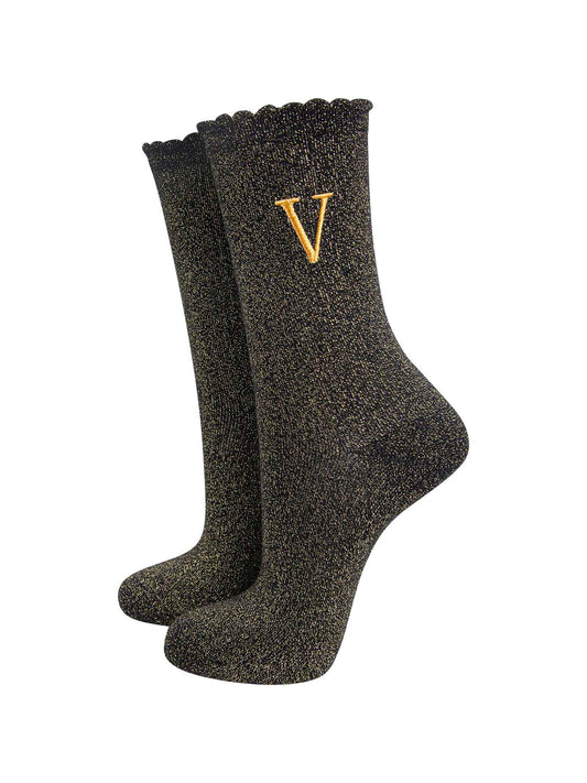 black ankle socks with a scalloped cuff, with an all over gold glitter sparkle and an embroidered gold letter v on the ankle