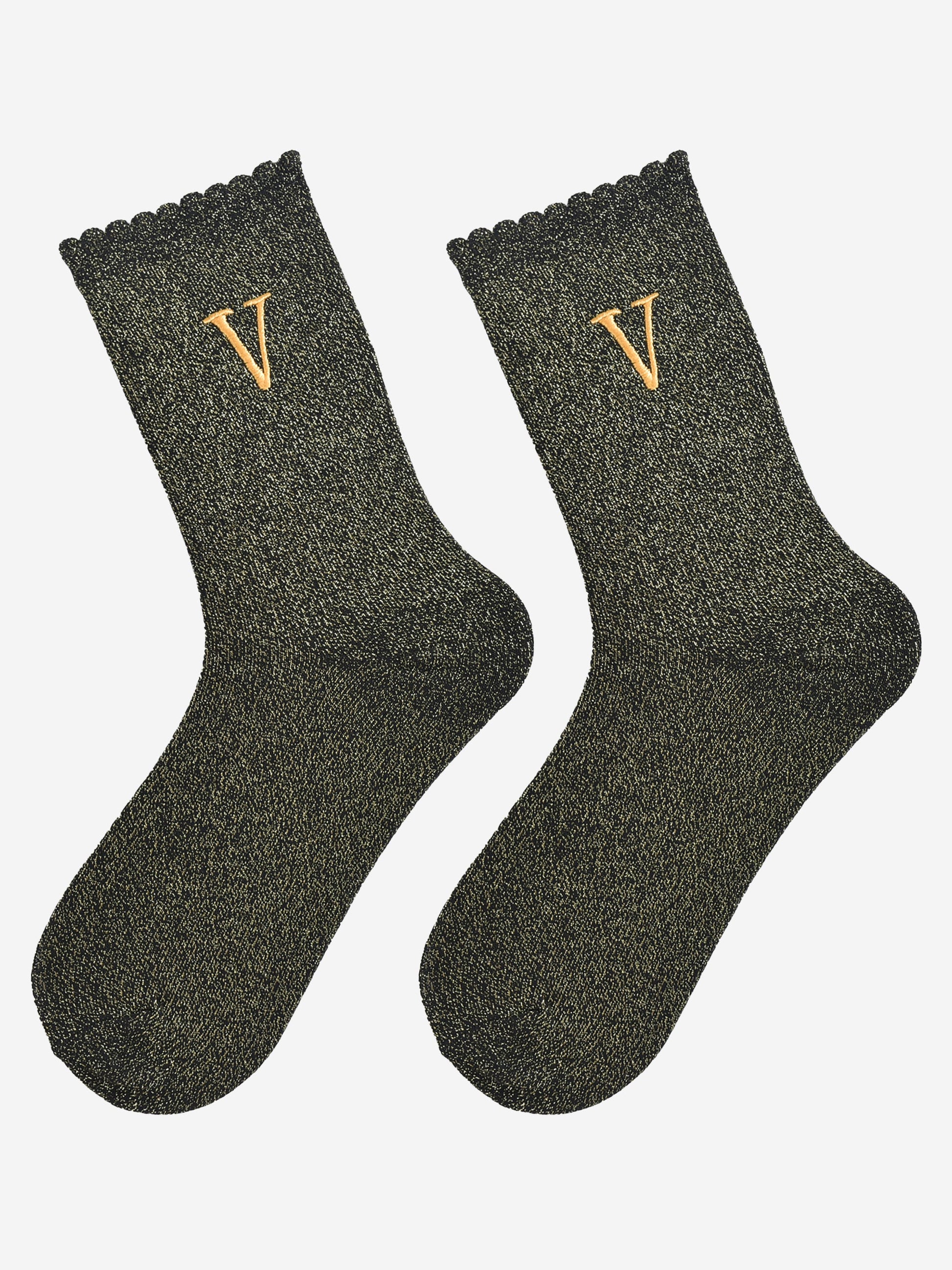 showing the glitter socks laying flat, they have a scalloped cuff and an all over gold sparkle