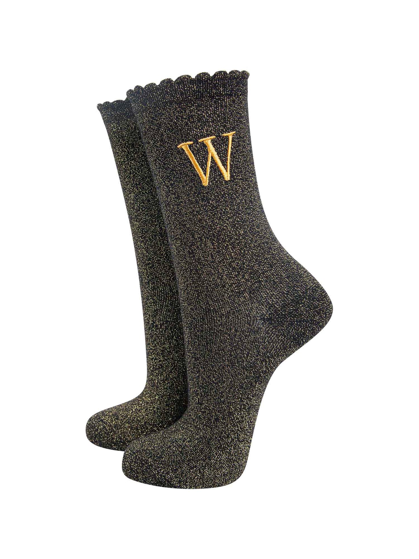 black ankle socks with a scalloped cuff, with an all over gold glitter sparkle and an embroidered gold letter w on the ankle