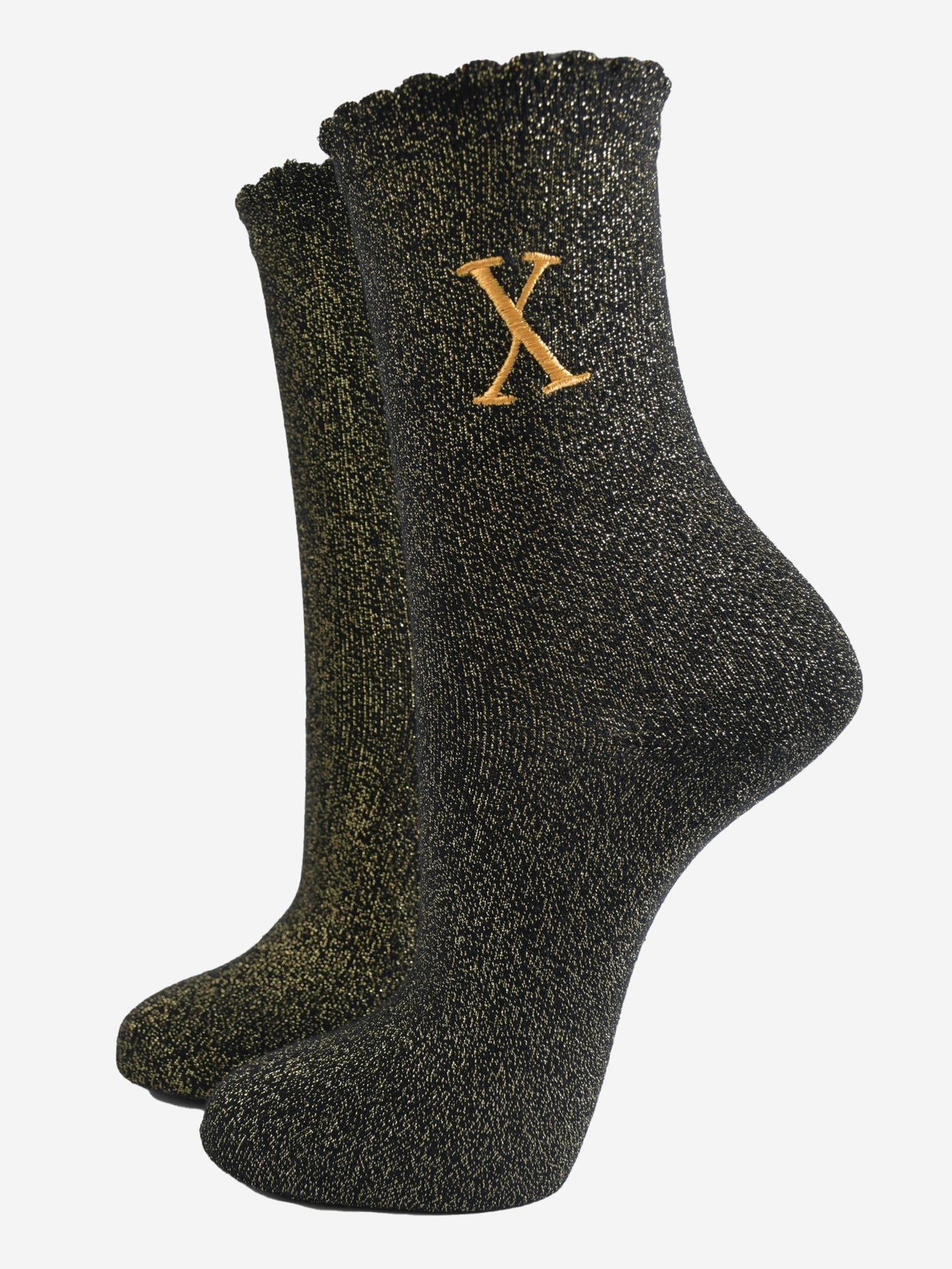 black ankle socks with a scalloped cuff, with an all over gold glitter sparkle and an embroidered gold letter x on the ankle