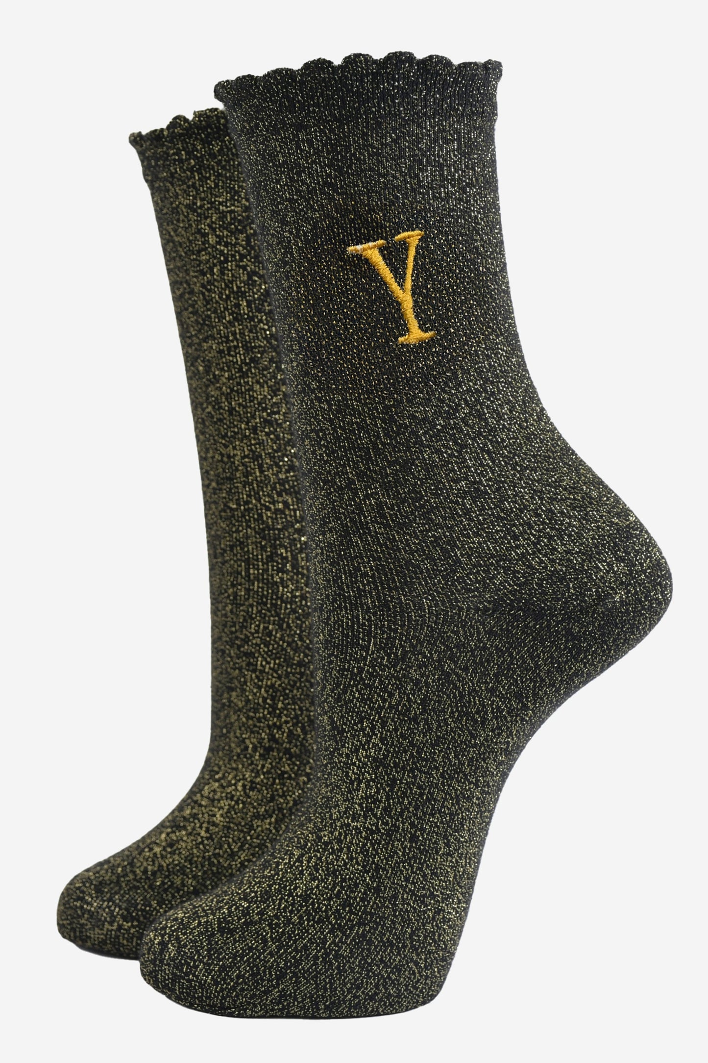 black ankle socks with a scalloped cuff, with an all over gold glitter sparkle and an embroidered gold letter y on the ankle