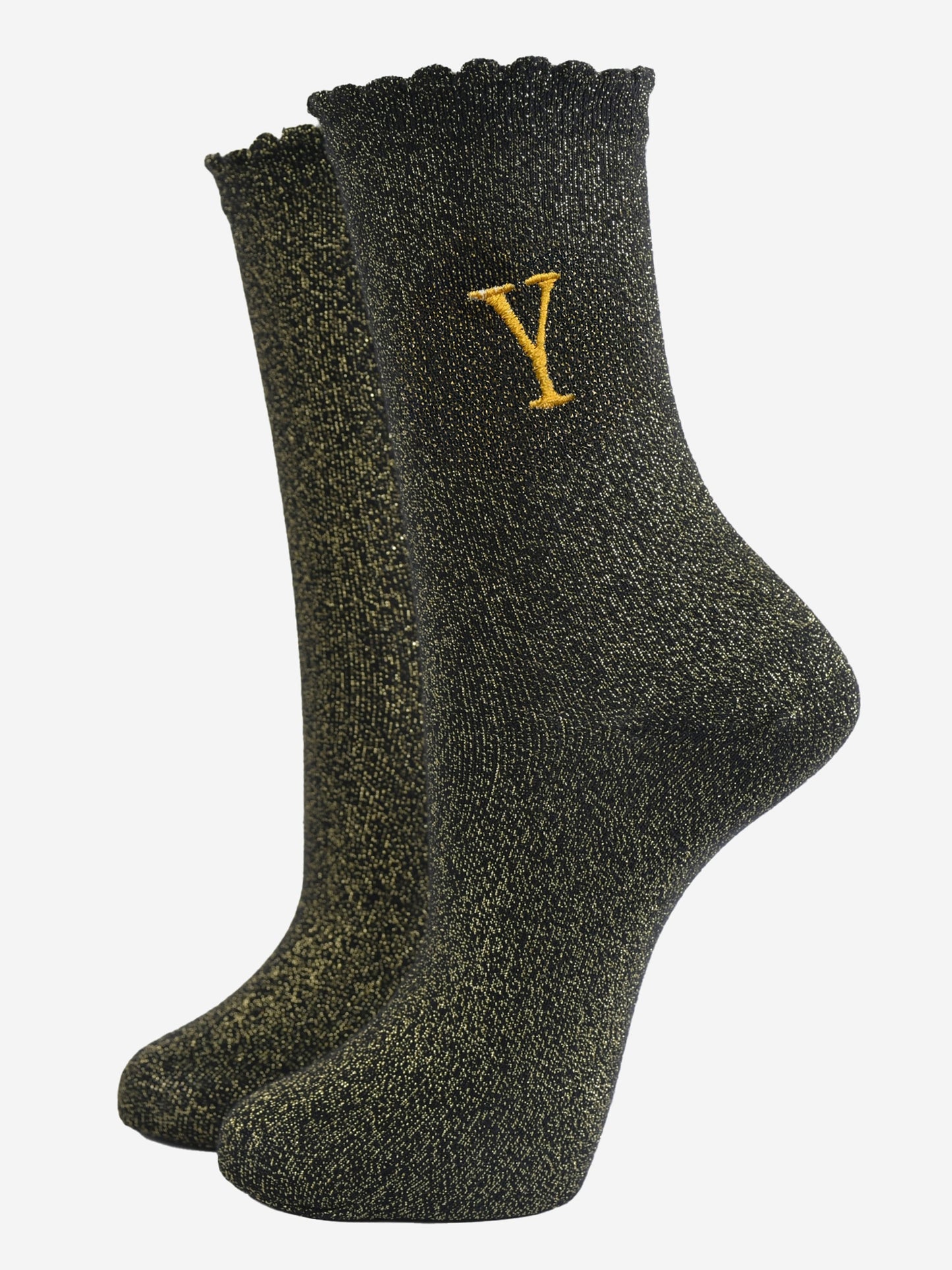 black ankle socks with a scalloped cuff, with an all over gold glitter sparkle and an embroidered gold letter y on the ankle