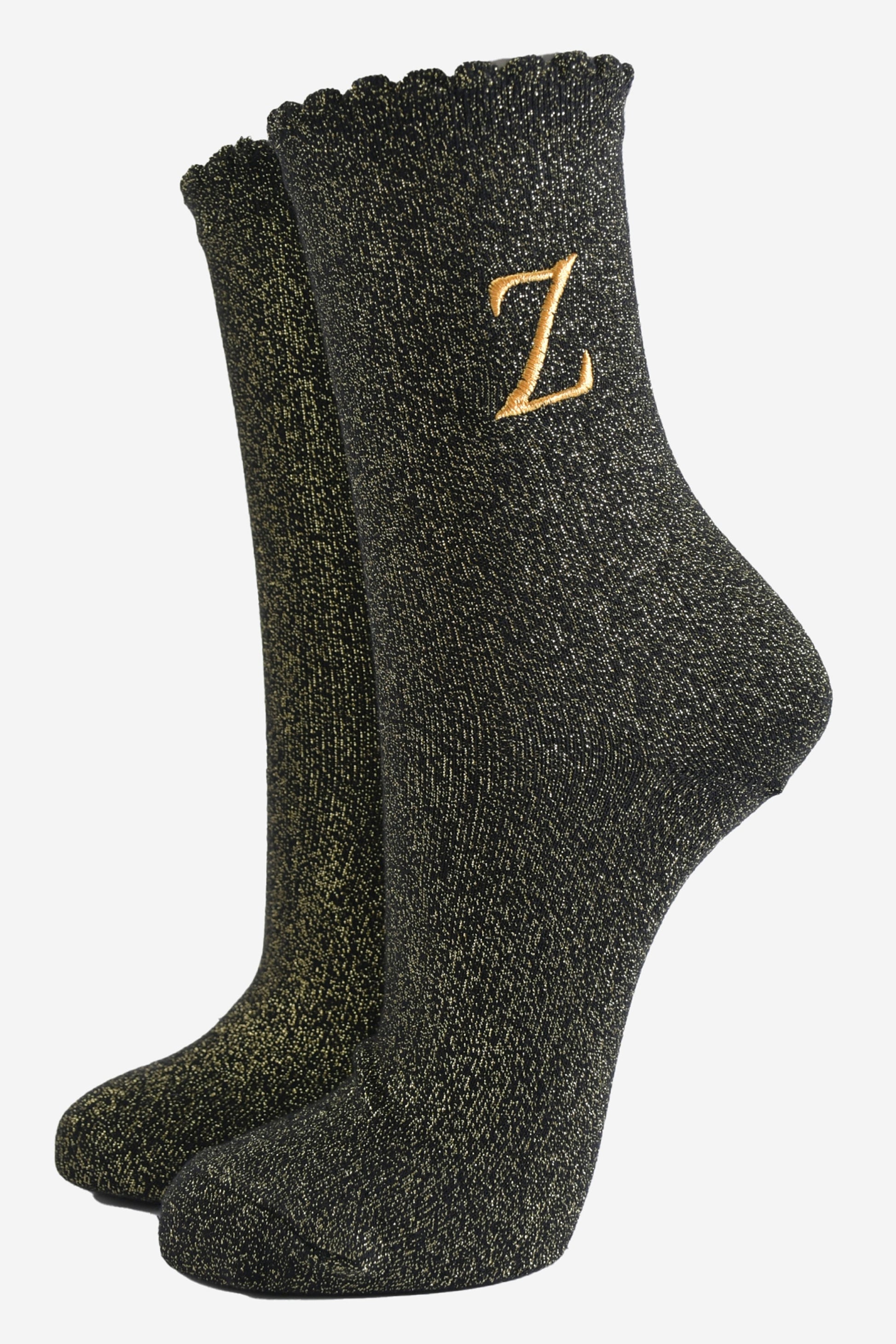 black ankle socks with a scalloped cuff, with an all over gold glitter sparkle and an embroidered gold letter z on the ankle