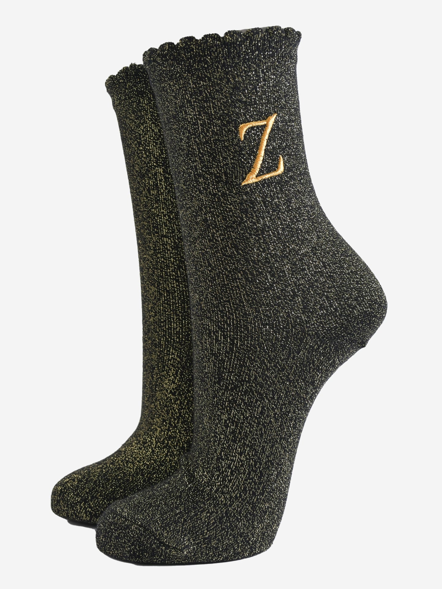 black ankle socks with a scalloped cuff, with an all over gold glitter sparkle and an embroidered gold letter z on the ankle