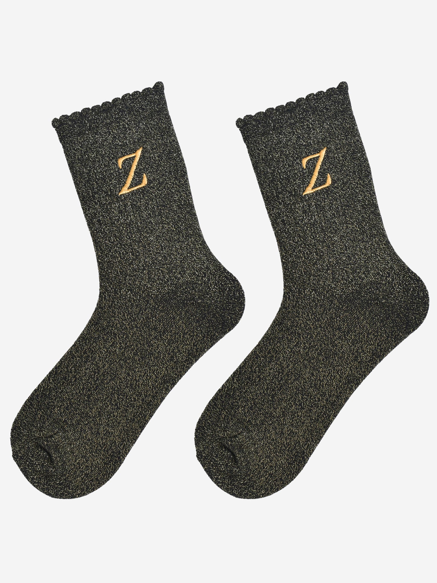 showing the glitter socks laying flat, they have a scalloped cuff and an all over gold sparkle