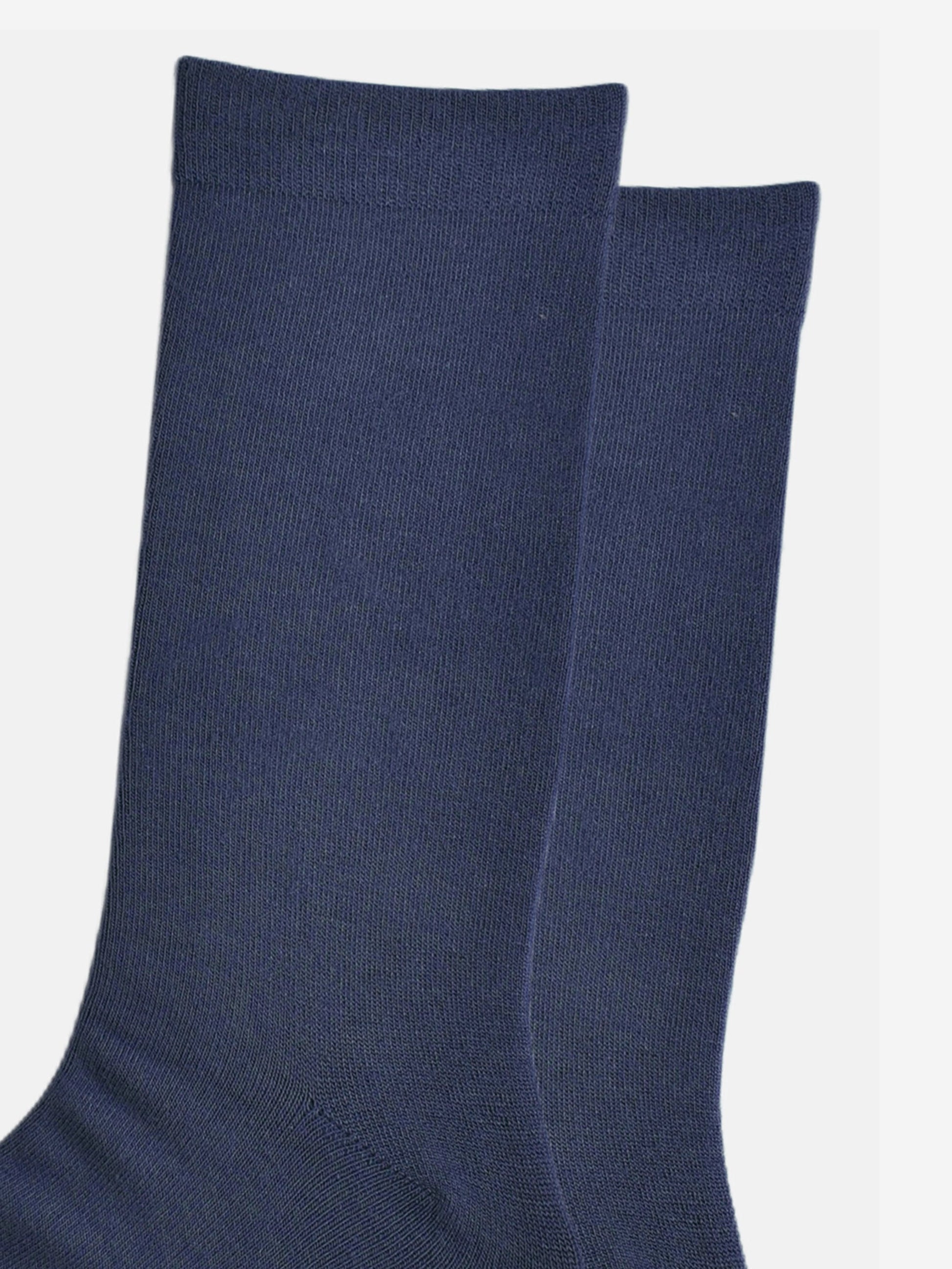 close up of the plain navy blue bamboo socks