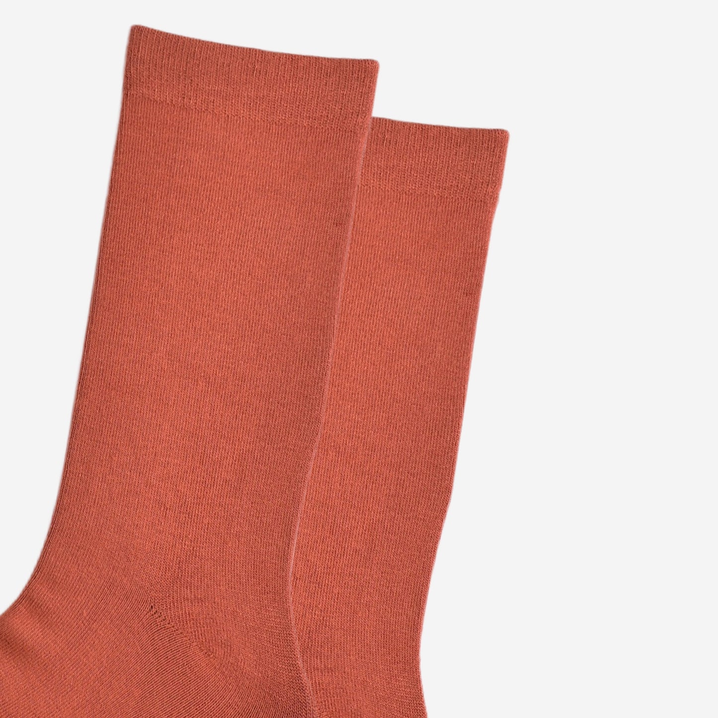 close up of the plain rust orange socks