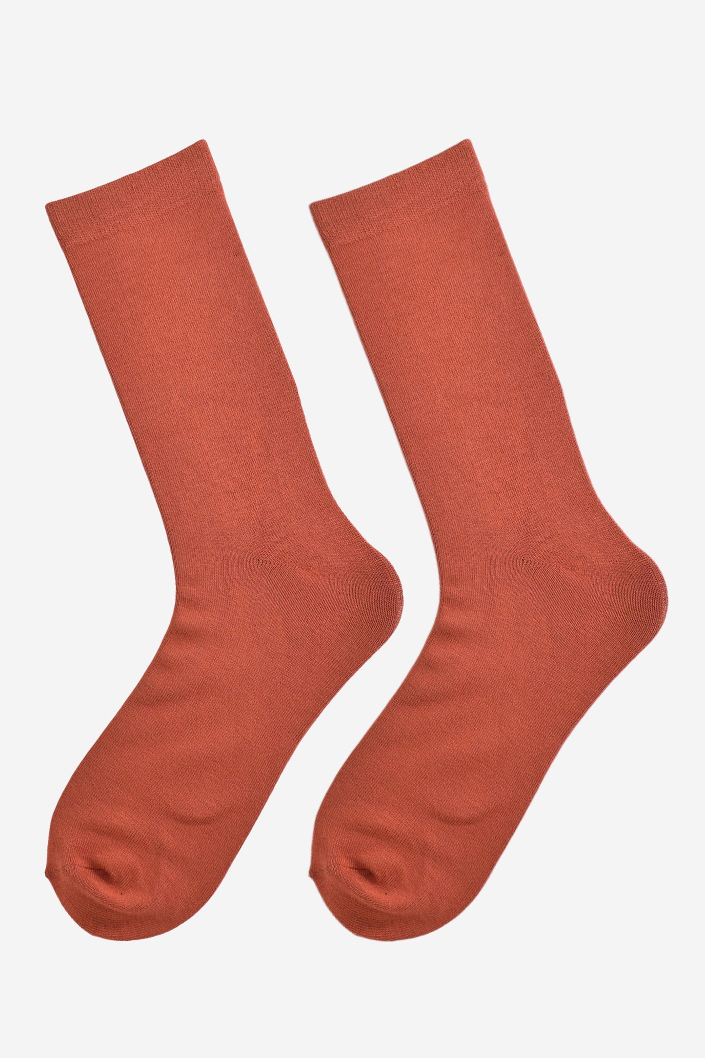 rust orange bamboo socks laying flat, showing the all over consistent colour