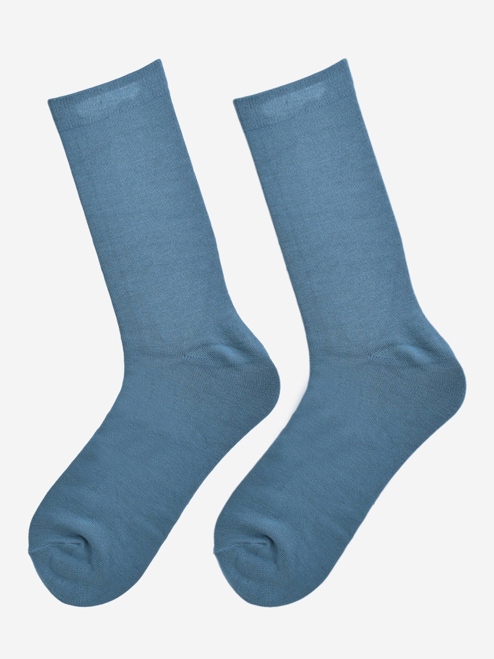 teal blue bamboo socks laying flat, showing the all over consistent colour