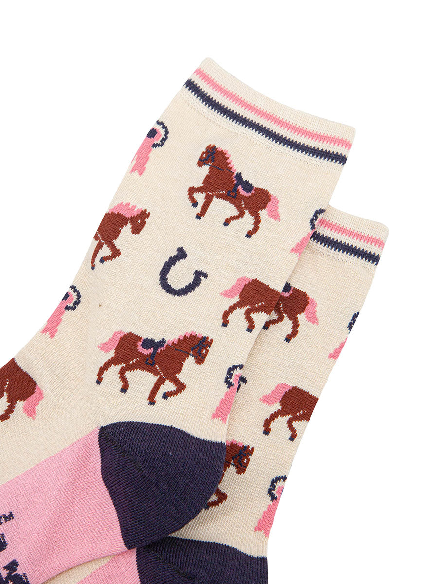 womens-bamboo-socks-cream-horse-riding-close-up-horses-wearing-saddles-and-bridles-pink-eventing-rosettes-large-horseshoes