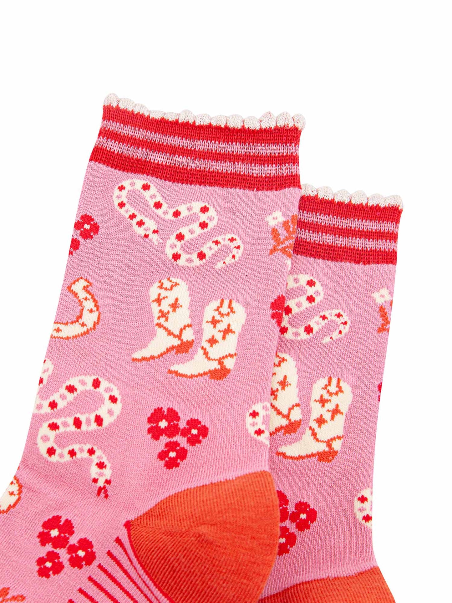 womens-bamboo-socks-pink-western-cowgirl-snakes-close-up-white-cowboy-boots-winding-rattle-snakes-red-desert-flowers-all-on-pink-background