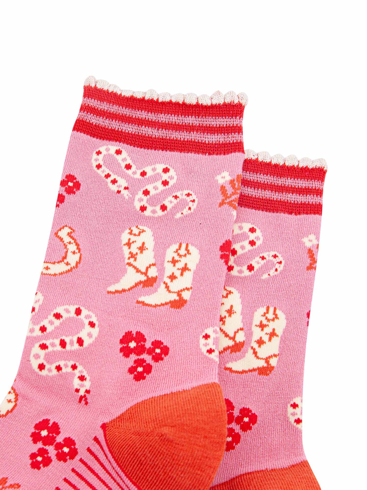 womens-bamboo-socks-pink-western-cowgirl-snakes-close-up-white-cowboy-boots-winding-rattle-snakes-red-desert-flowers-all-on-pink-background
