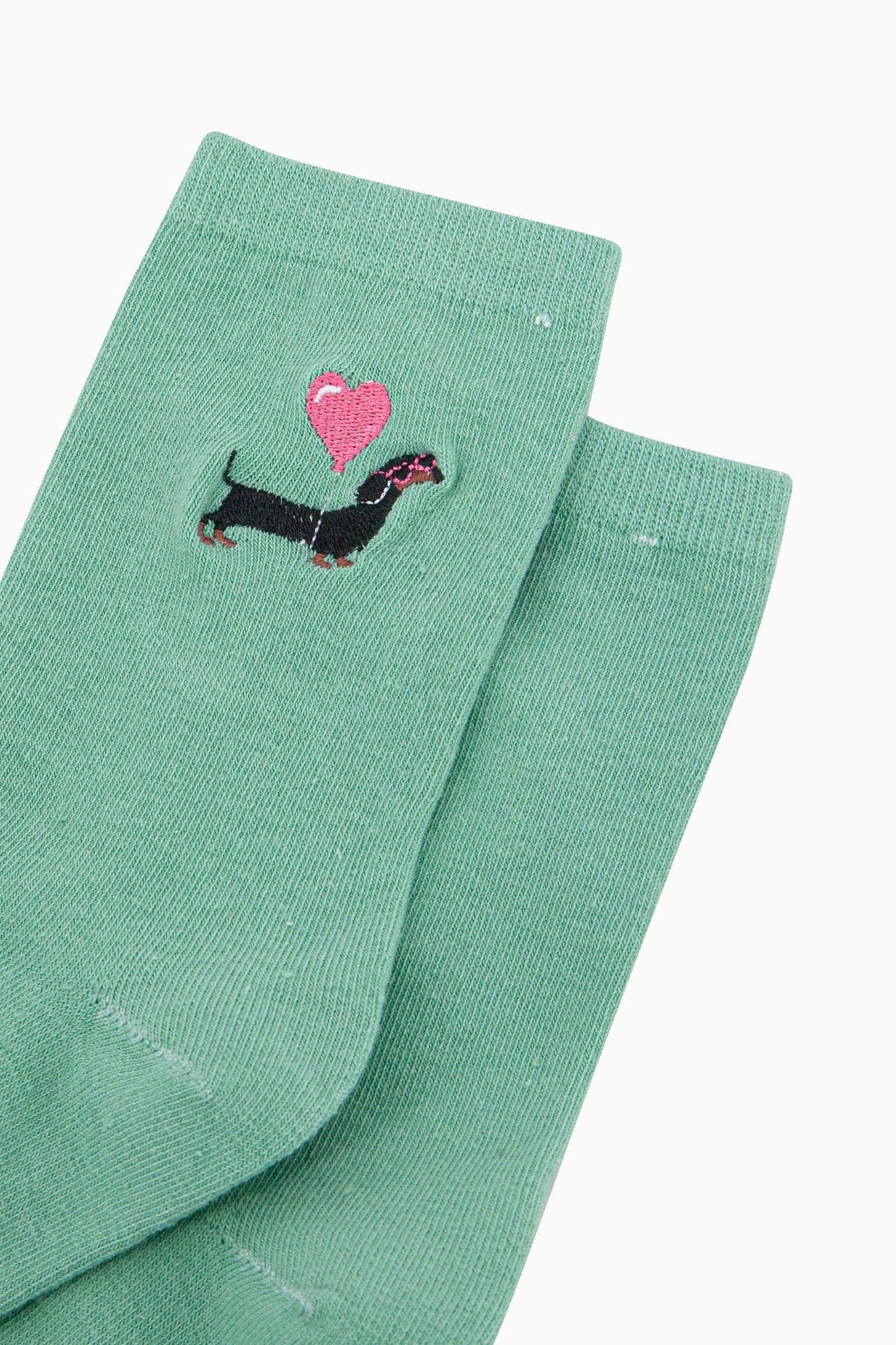 womens-embroidered-socks-mint-sausage-dog-heart-balloon-close-up-black-dachshund-wearing-pink-sunglasses-carrying-pink-balloon