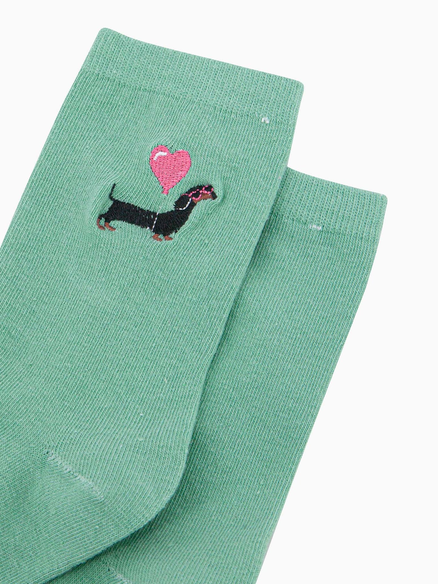 womens-embroidered-socks-mint-sausage-dog-heart-balloon-close-up-black-dachshund-wearing-pink-sunglasses-carrying-pink-balloon