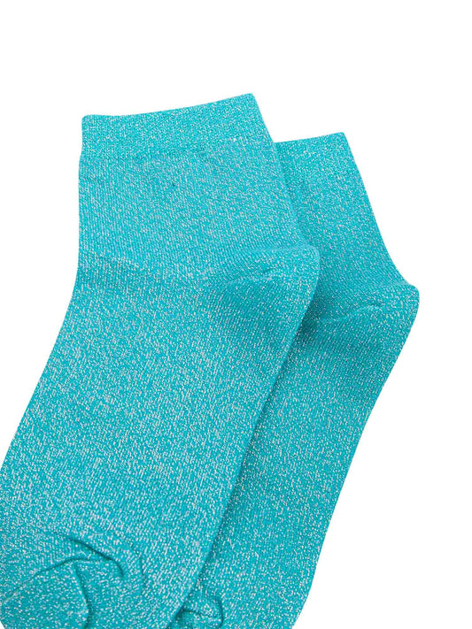 close up of the sparkly glitter effect on the turquoise anklet socks
