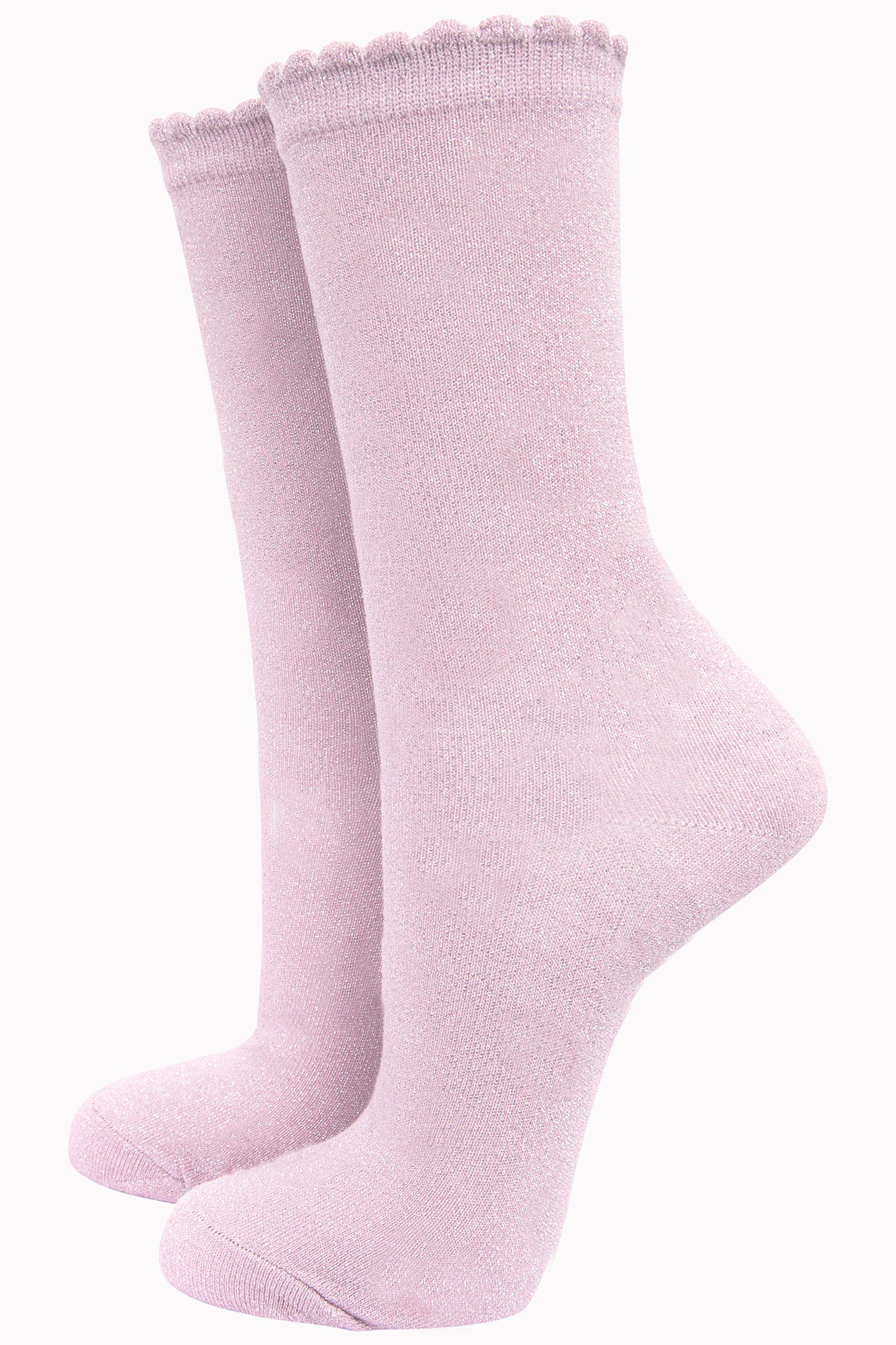 light pink cotton socks with an all over glitter shimmer, the socks have a scalloped cuff edge