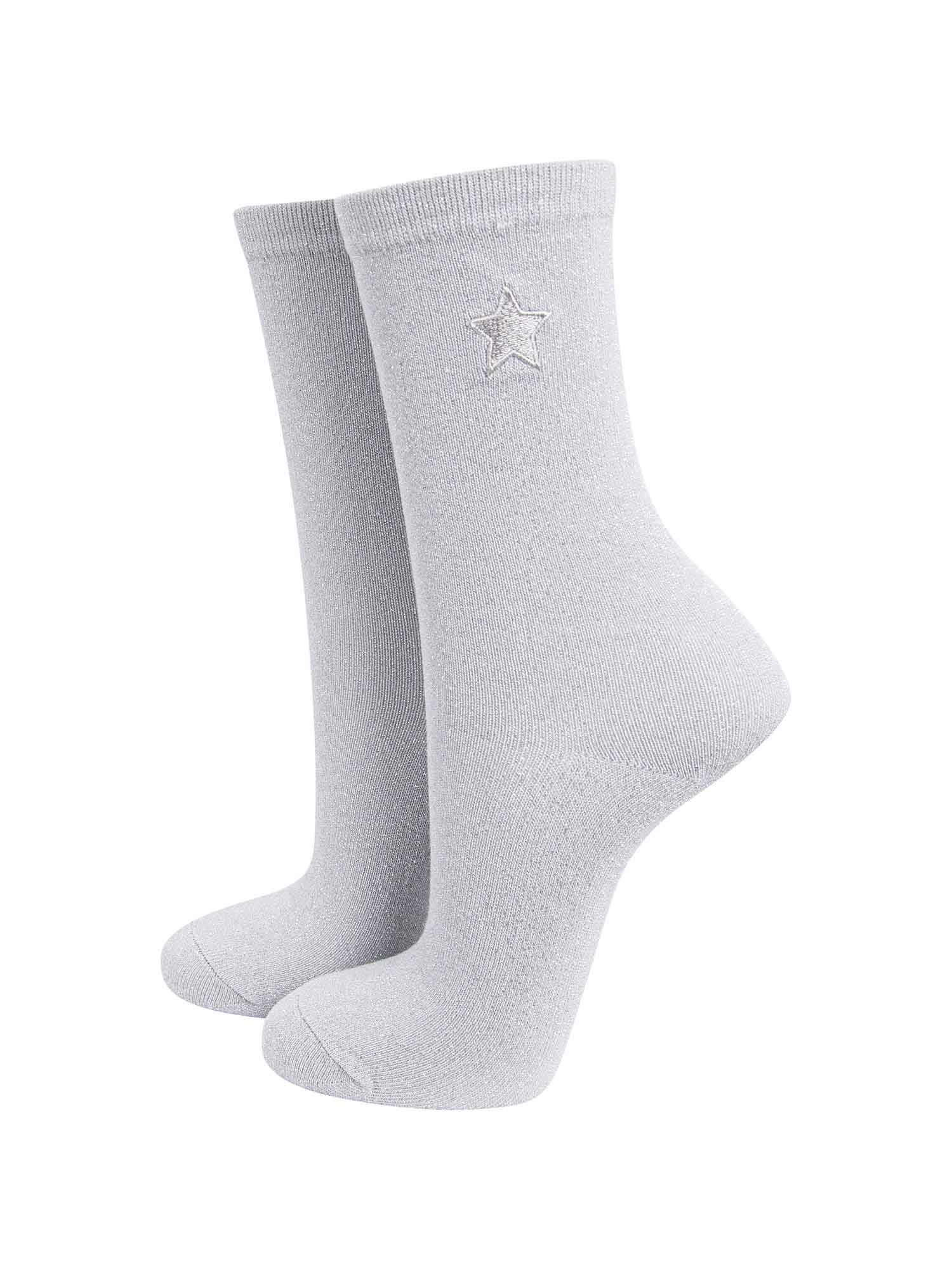 white and silver glitter socks with an embroidered star on the ankle
