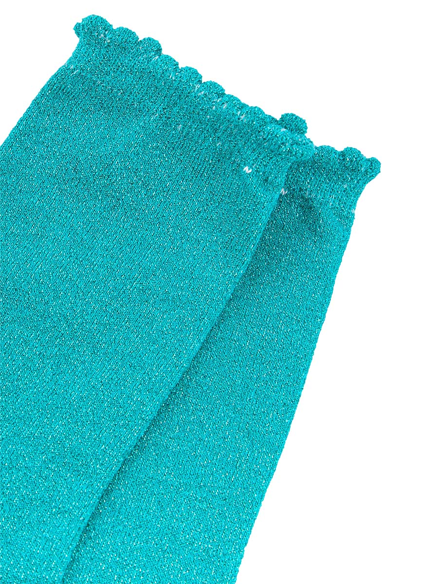 close up of the sparkly glitter material and scalloped cuff edges