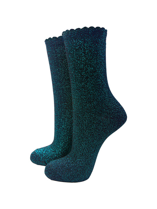 black cotton socks with an all over turquoise glitter shimmer, the socks have a scalloped cuff edge