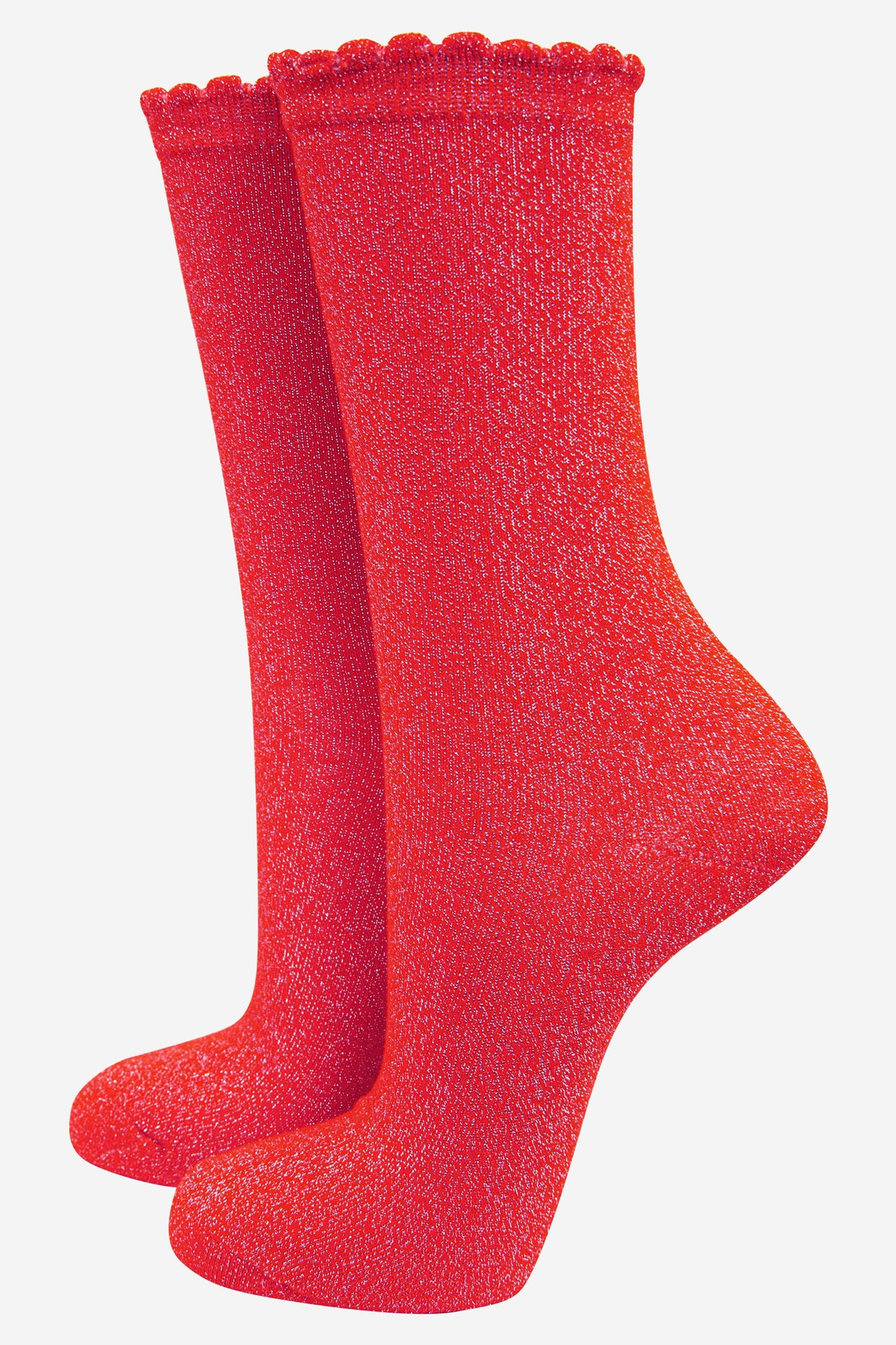 red cotton socks with an all over silver glitter shimmer, the socks have a scalloped cuff edge