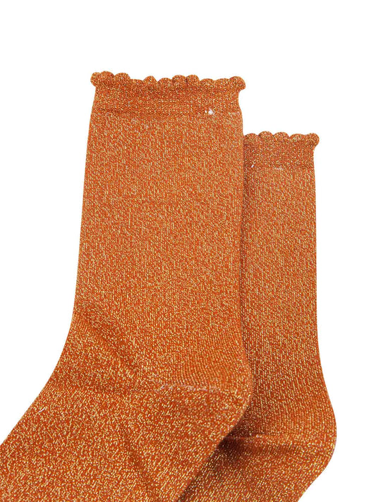 burnt orange cotton socks with an all over silver glitter shimmer, the socks have a scalloped cuff edge