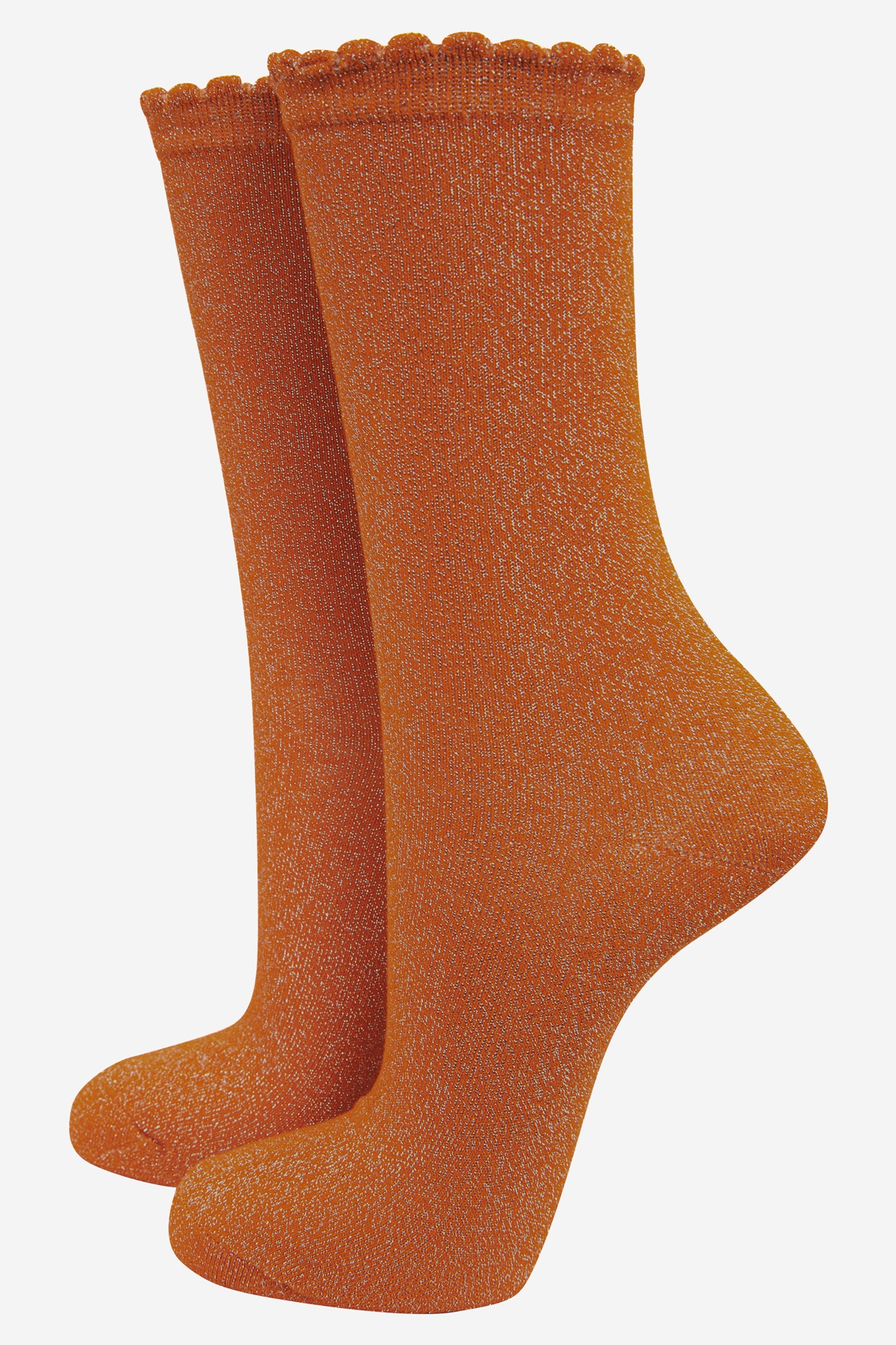 burnt orange cotton socks with an all over silver glitter shimmer, the socks have a scalloped cuff edge