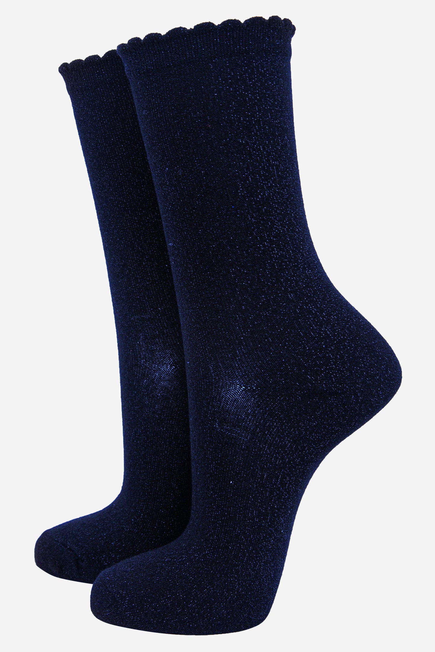 black cotton socks with an all over royal blue glitter shimmer, the socks have a scalloped cuff edge