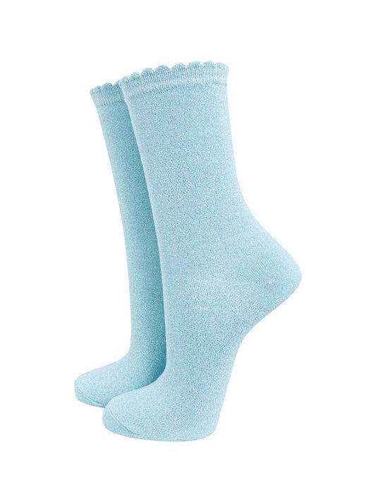 duck egg blue cotton socks with an all over silver glitter shimmer, the socks have a scalloped cuff edge