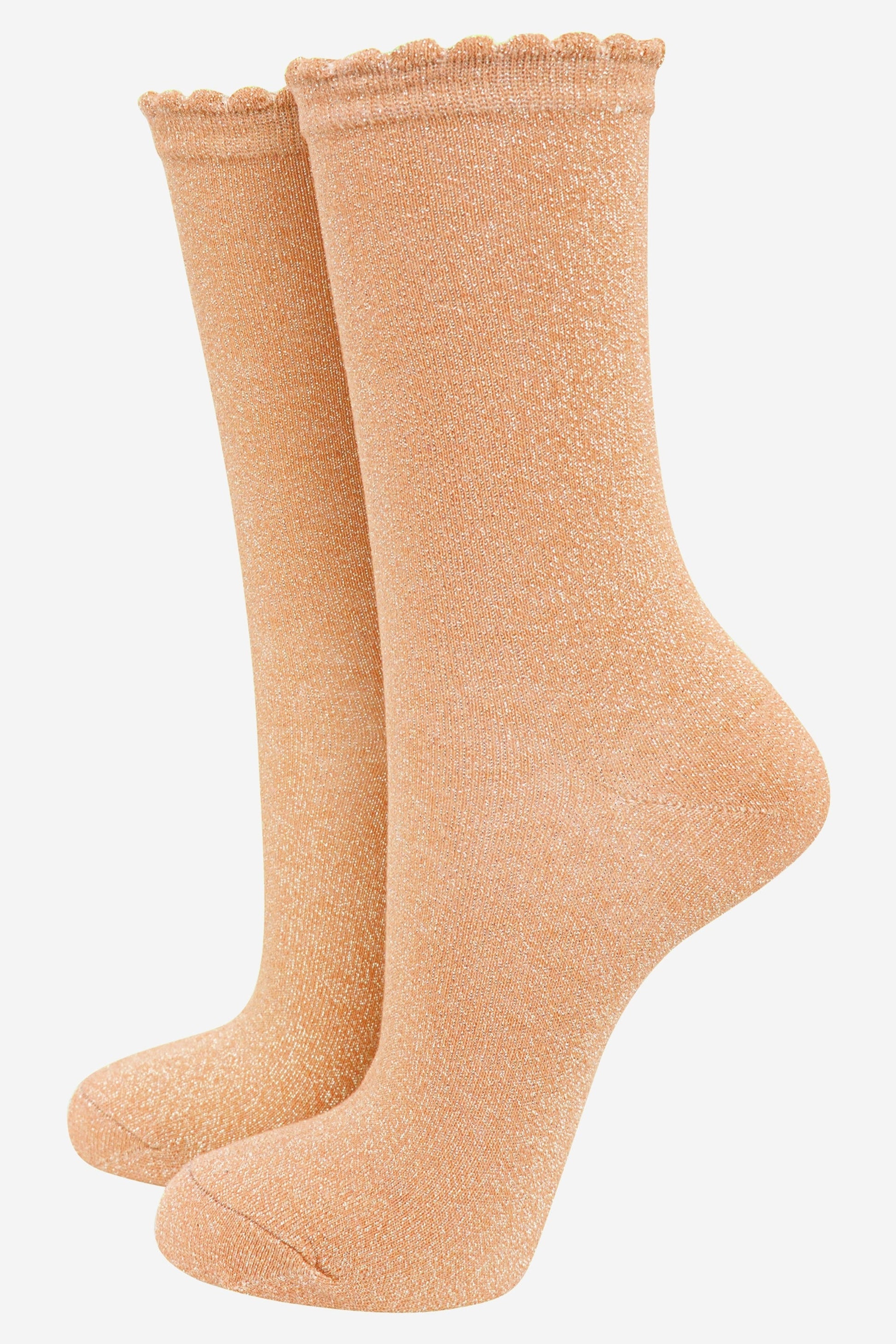 gold cotton socks with an all over glitter shimmer, the socks have a scalloped cuff edge