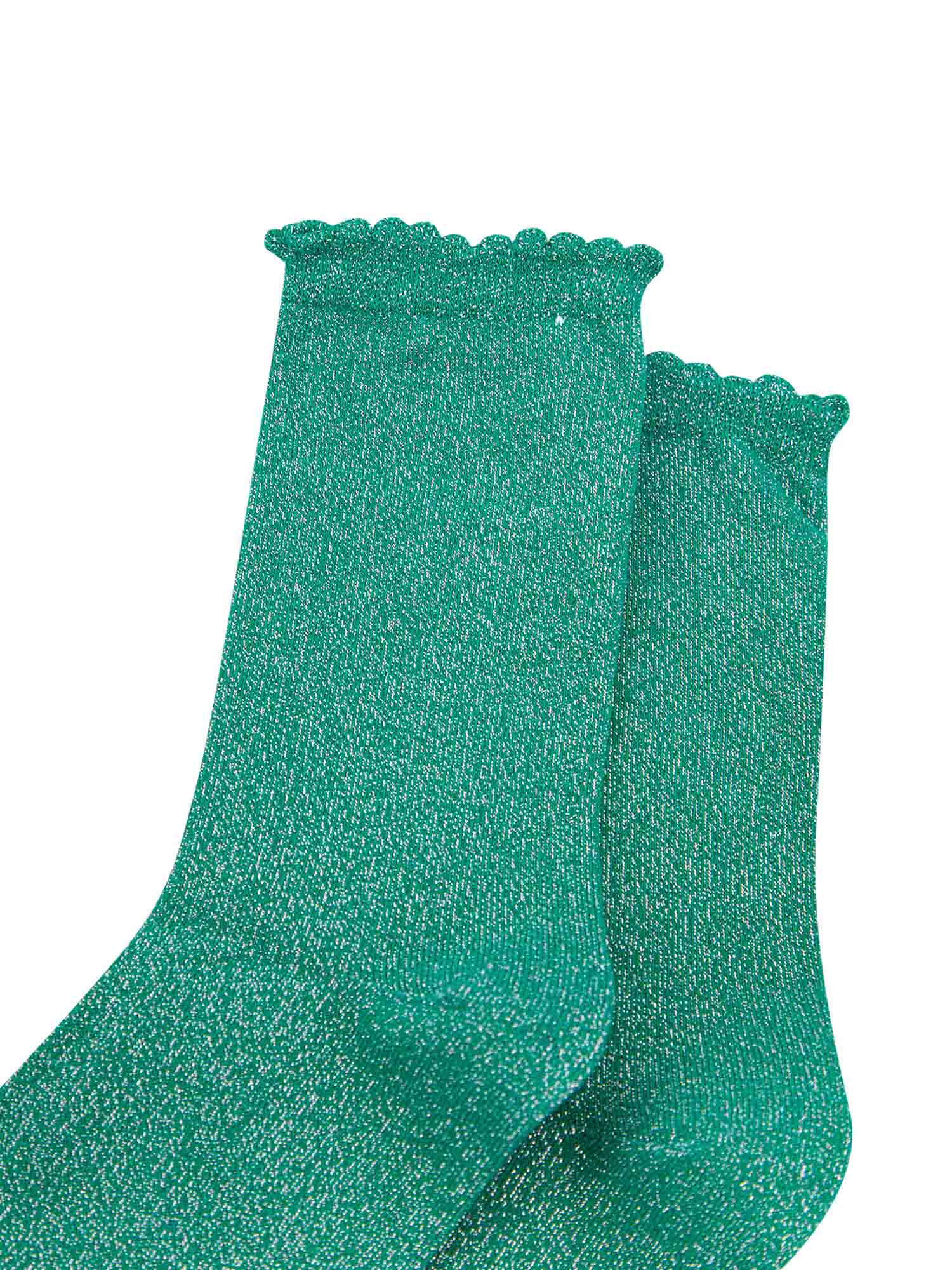 close up of the green and silver glitter socks and scalloped cuffs