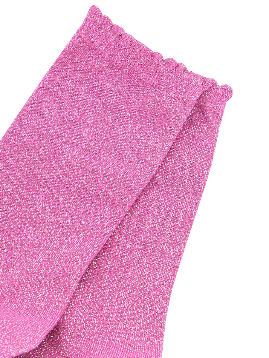 close up of the sparkly glitter material and scalloped cuff edges