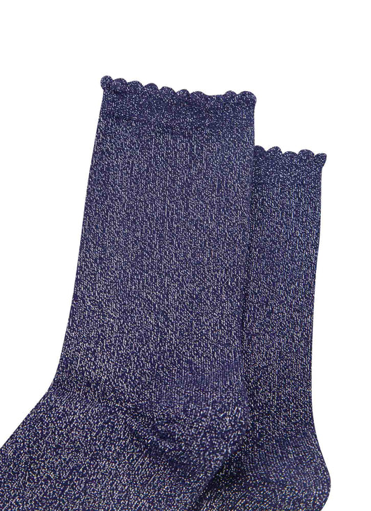 close up of the navy blue and silver glitter socks and scalloped cuffs
