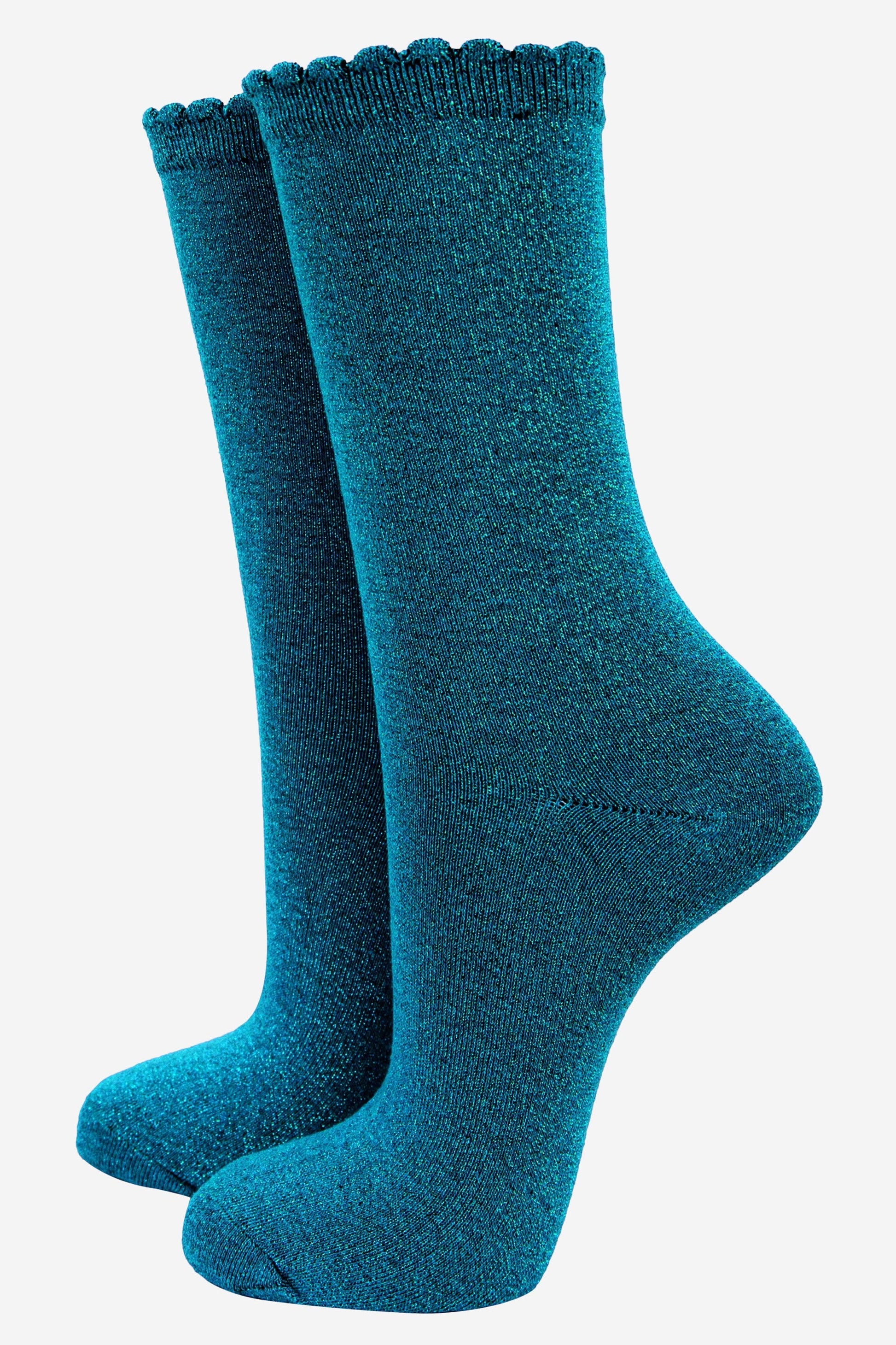 teal cotton socks with an all over glitter shimmer, the socks have a scalloped cuff edge