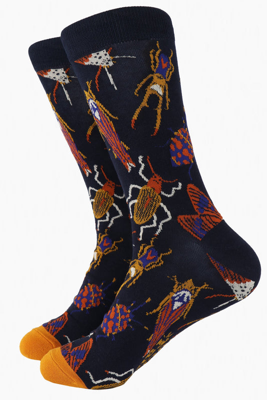 navy blue and mustard yellow bamboo socks with an all over pattern of beetles, bugs and insects