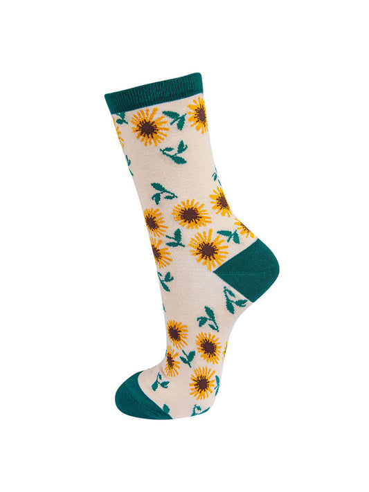 cream, green ankle socks with an all over yellow sunflower pattern

