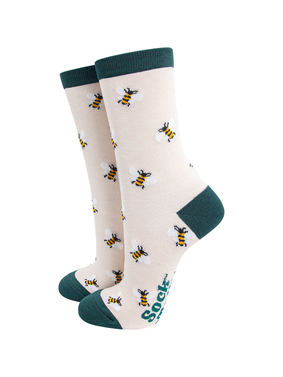 cream bamboo socks, green toe, heel and trim, all over bee print