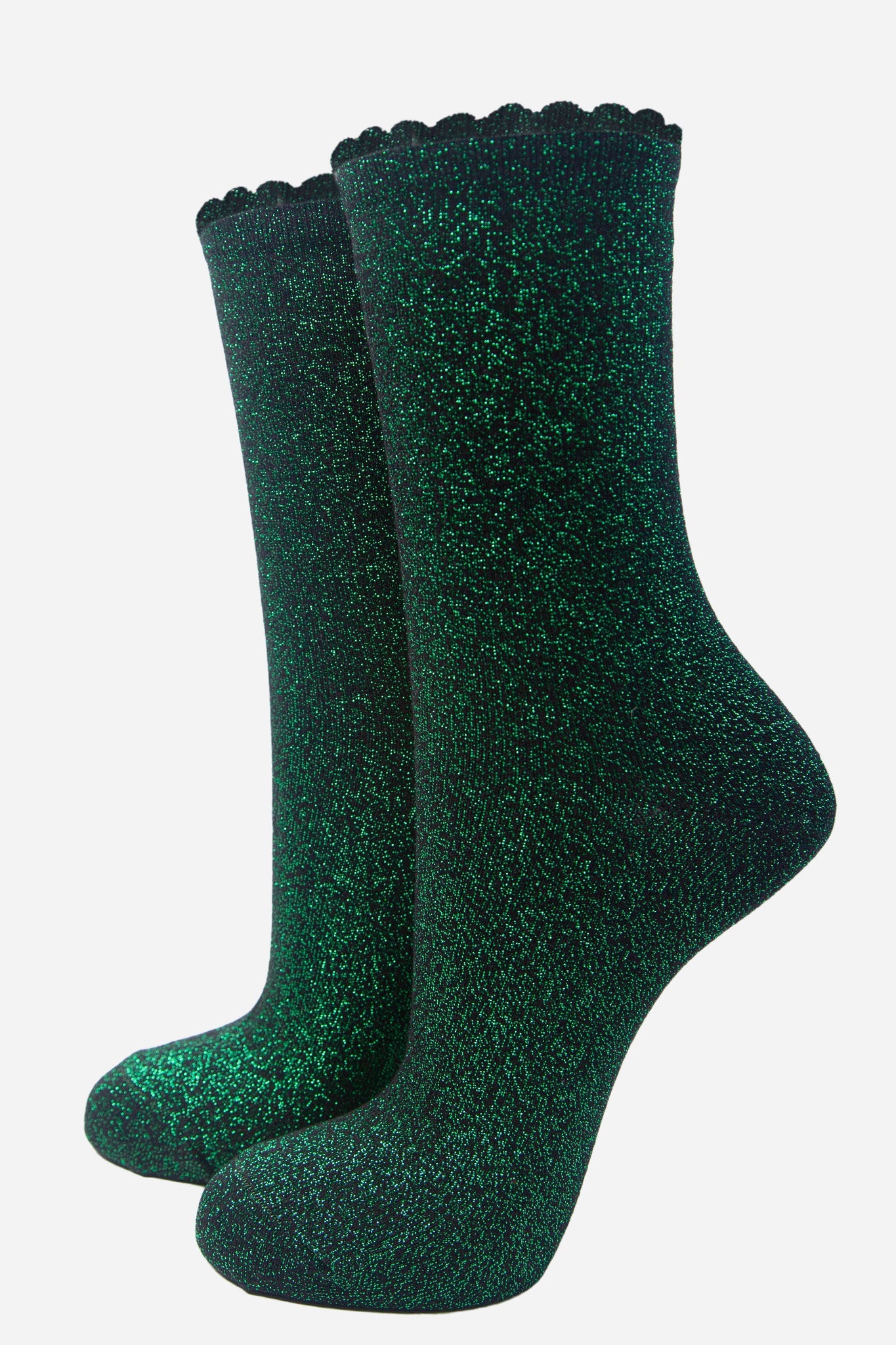 black cotton socks with an all over bright green glitter shimmer, the socks have a scalloped cuff edge