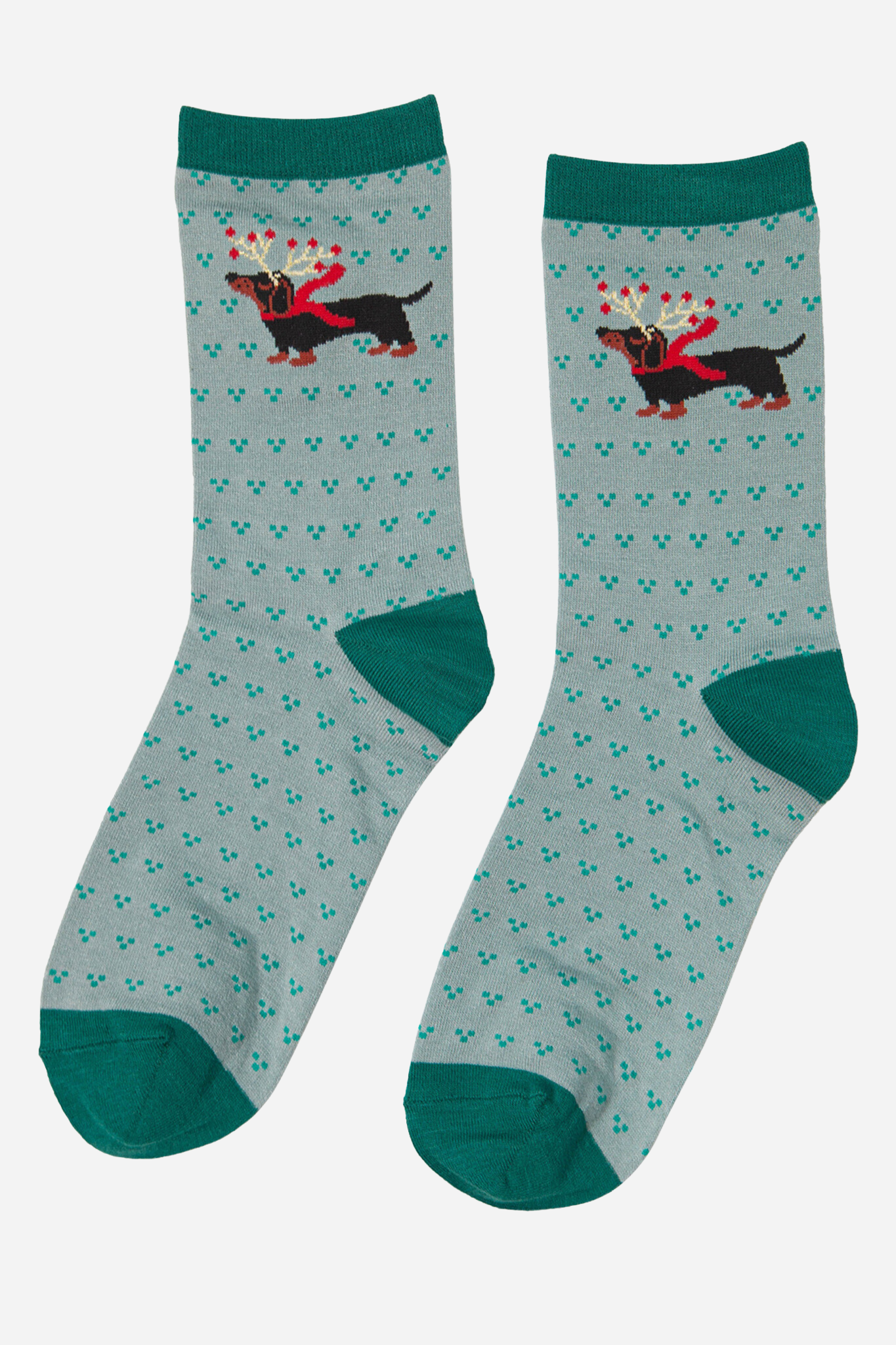 green festive sausage dog novelty socks with the dogs wearing xmas reindeer antlers