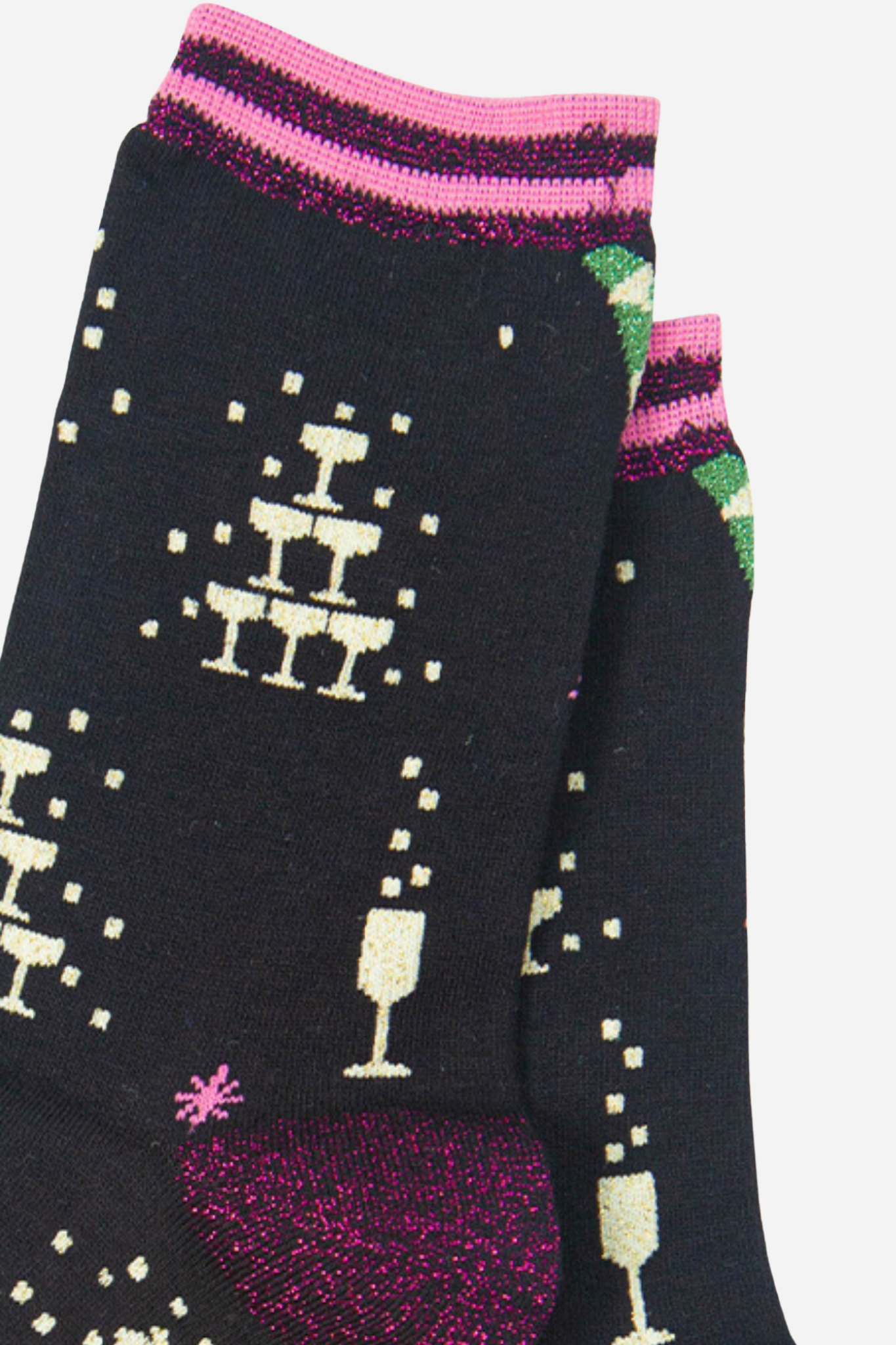 close up of the champagne celebration glitter pattern on the black bamboo socks
