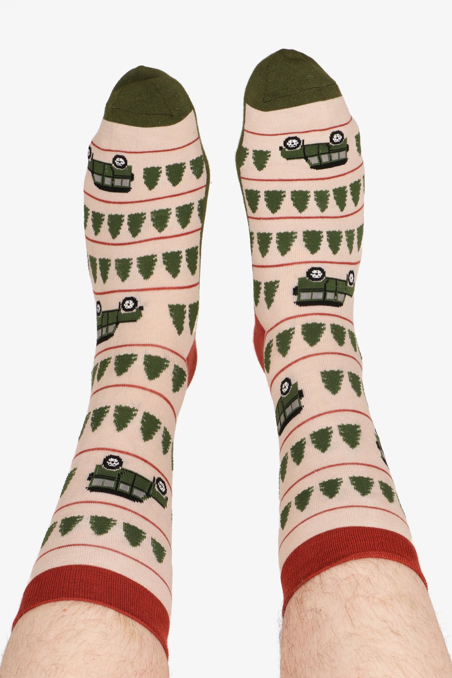 Men's feet in the air wearing sock talk bamoo socks. Contrasting toe in green can be seen