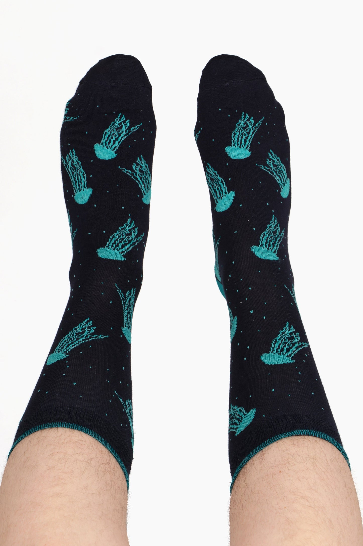 Men's feet in the air showing jellyfish print bamboo fibre socks