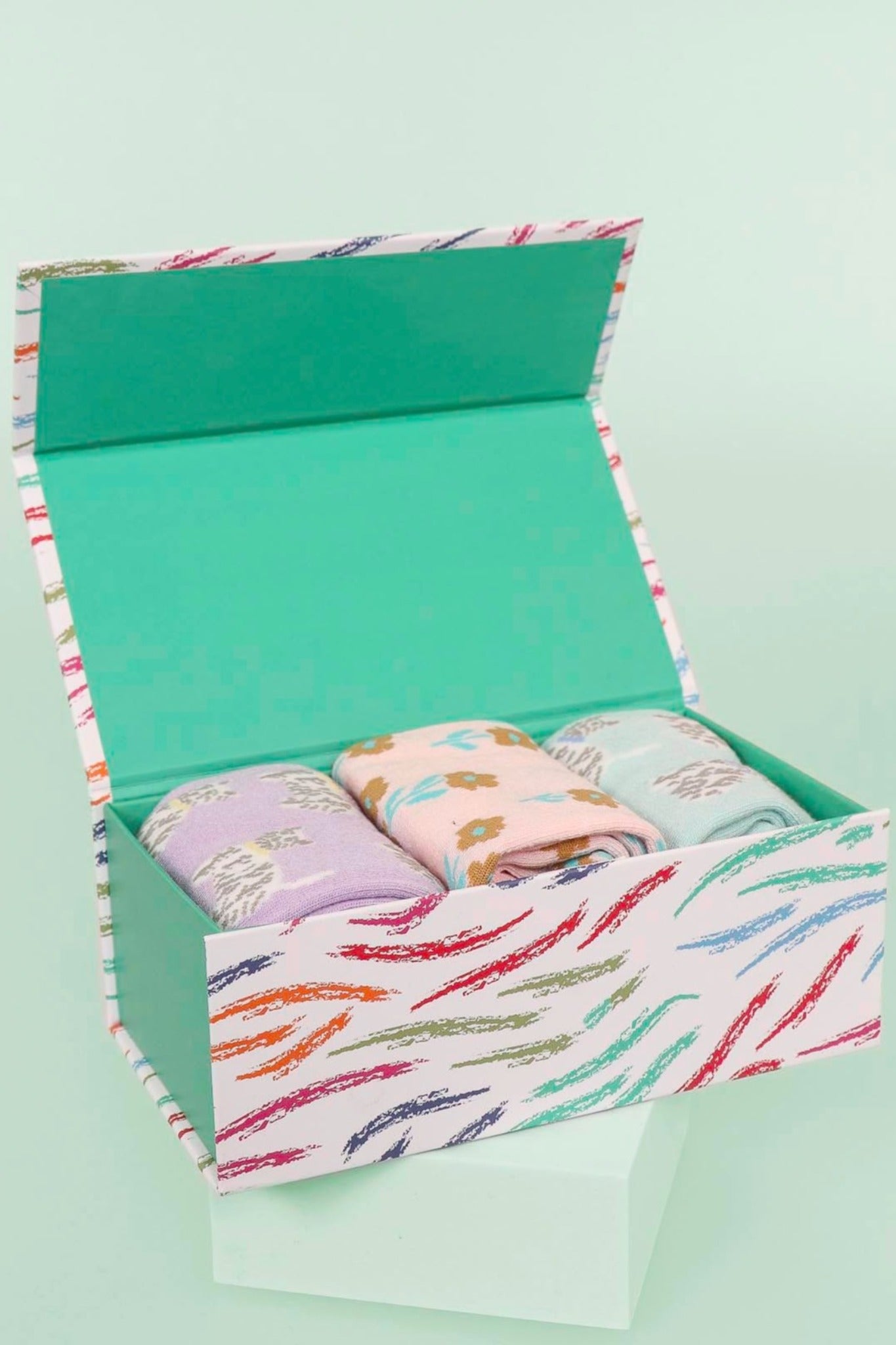 multicoloured sock gift box with three pairs of womens bamboo ankle socks featuring highland terriers and flowers