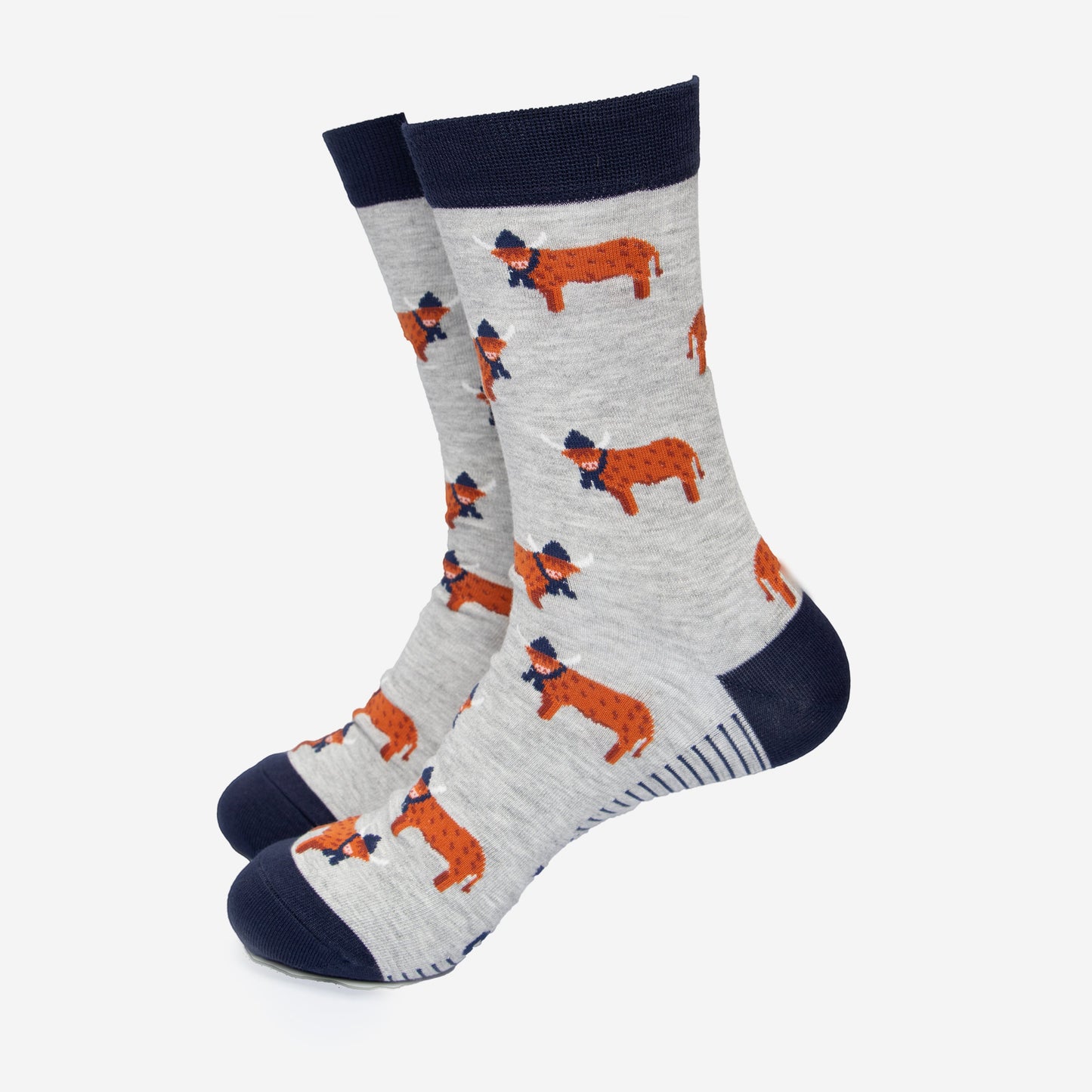 grey dress socks with a navy blue heel, toe and cuff with an all over pattern of orange standing highland cows, the cows are wearing winter hats and scarves