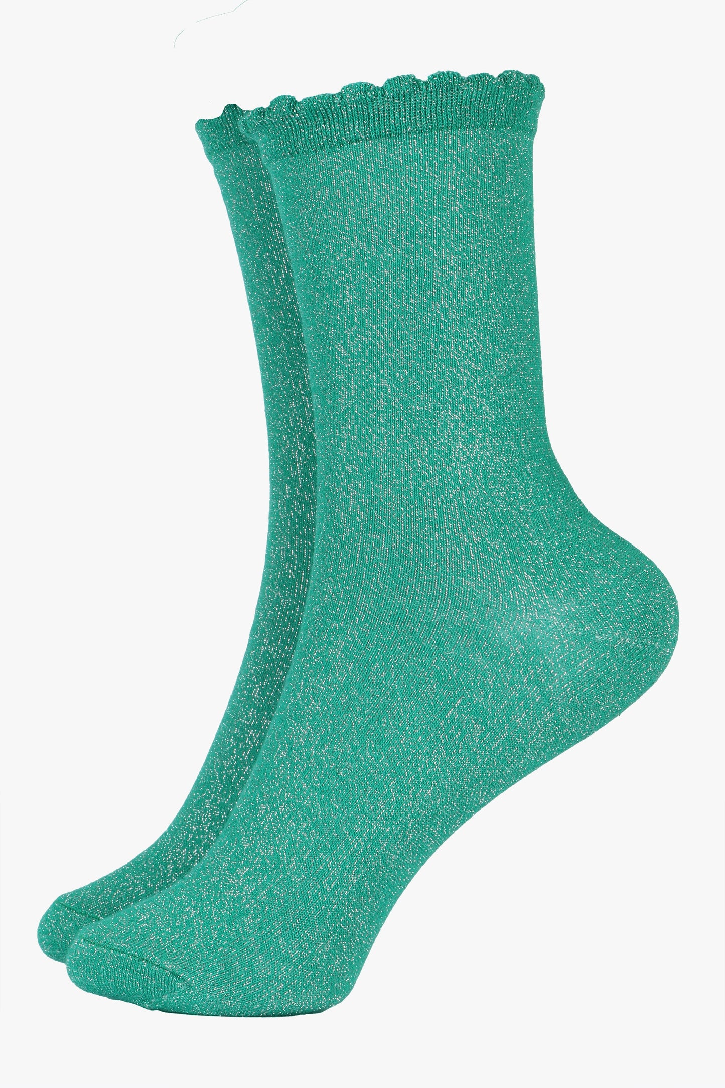 green cotton socks with an all over silver glitter shimmer, the socks have a scalloped cuff edge