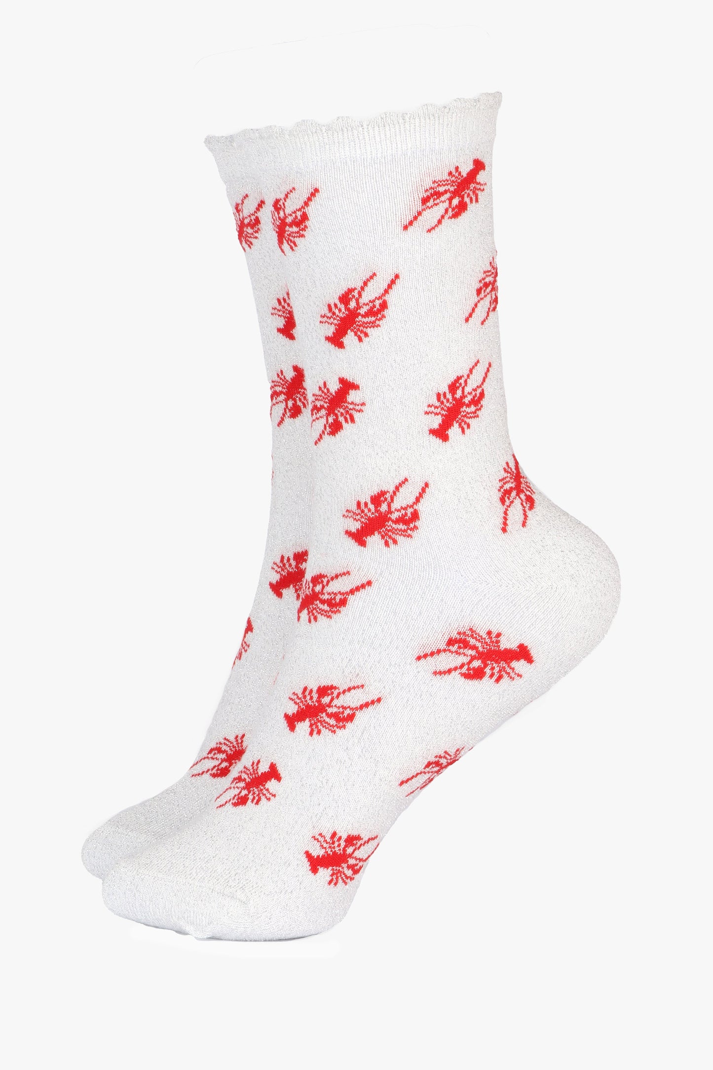 white cotton socks with an all over red lobster print pattern and silver glitter shimmer, the socks have a scalloped cuff edge